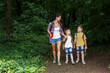 © BalanceFormCreative - Mother and her little sons hiking trough forest .Outdoor spring leisure concept.