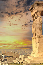 Caryatids Nymphs Statues On Acropolis Of Athens And Dramatic Sky During Sunset, Greece