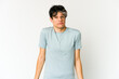 © Asier - Young skinny hispanic man shrugs shoulders and open eyes confused.