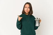 Young Hispanic Woman Holding A Coffee Maker Having An Idea, Inspiration Concept.