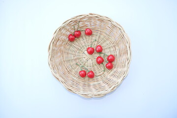 Canvas Print - seasonal fruit in basket on white background