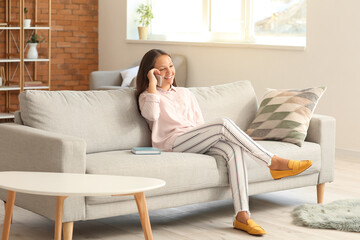 Poster - Cute teenage girl with mobile phone at home