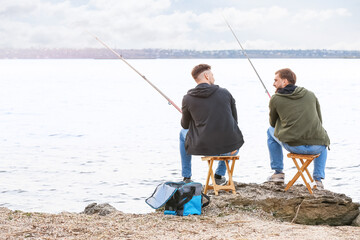 Poster - Young men fishing on river