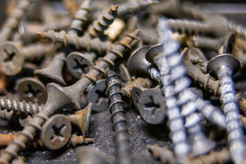 Macro photo of screws. Set of screws. Construction abstraction. Industrial background.