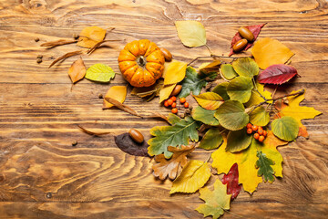 Beautiful autumn composition on wooden background