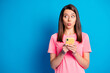 © deagreez - Photo portrait of curious young girl staring whistling looking copyspace holding smartphone isolated on bright blue color background