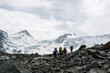© Павел Чигирь - a group of climbers goes through the rocky mountains on the background of the top of ' Belukha'