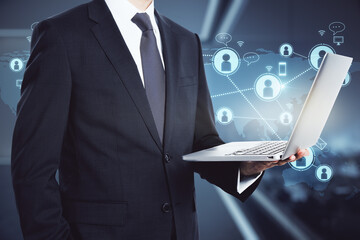 Poster - Businessman with laptop on social network icons background, networking concept