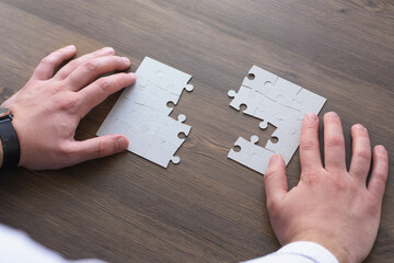 Wall Mural - Image of businesswoman connecting elements of white puzzle