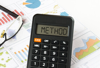 Calculator with text on the display Method it is on the financial charts with eyeglasses