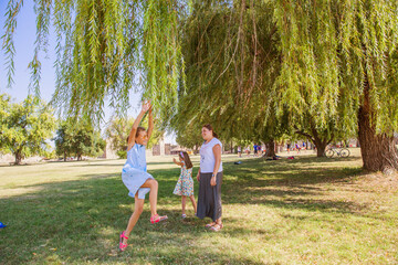 Wall Mural - Family have fun on beautiful summer day in the park