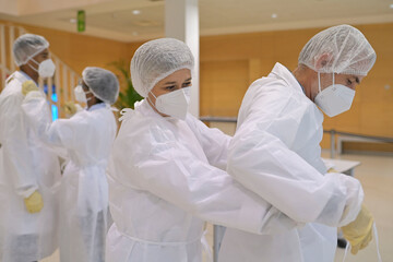 Wall Mural - Medical staff putting protective equipement on