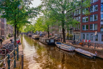 Wall Mural - Typical buildings and canal in Amsterdam by day, Netherlands