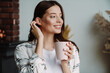 © Drobot Dean - Beautiful happy nice woman smiling and drinking coffee