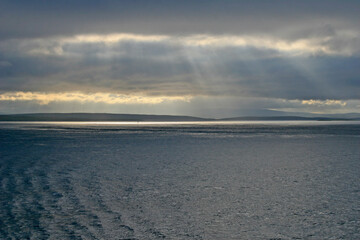 Wall Mural - sunset over the ocean with a view of shetland