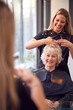 © Monkey Business - Senior Woman Having Hair Cut By Female Stylist In Hairdressing Salon