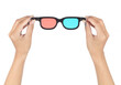 Hand holding 3d glasses isolated on a white background