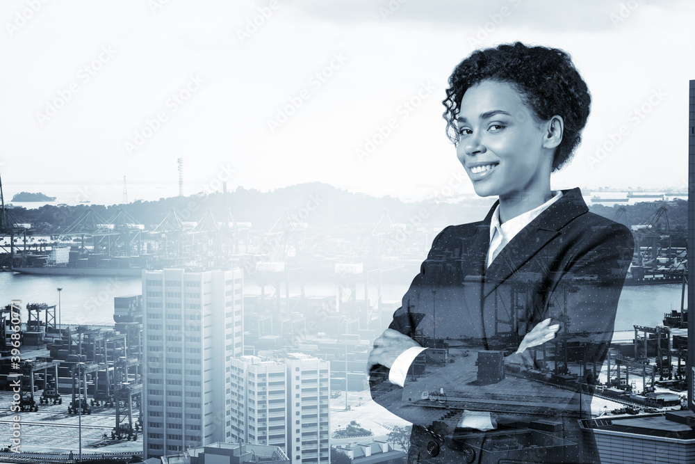 Smiling black African American business woman in suit in crossed arms ...