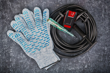 Electrician equipment on gray background top view, closeup