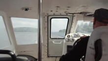 The Boat Driver Controls The Steering Wheel.