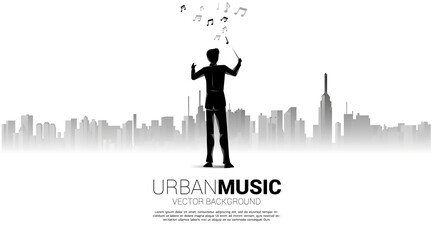 Canvas Print - Vector silhouette of conductor standing with city background. Concept for city of music.