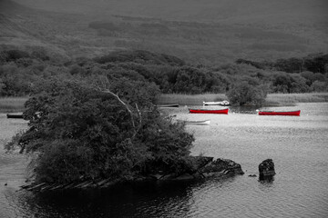 Ross lake, boats and kayaks, Killarney National Park, County Kerry, Ireland near Castle Ross. Wild Atlantic Way, Ring of Kerry