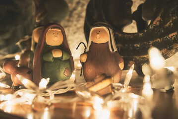 Nativity Scene on a wooden table with xmas lights