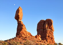 Balanced Rock Formation With Moon In Background, Arches National Park