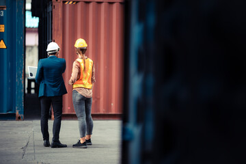 Wall Mural - Businessmen, executives and engineers wear medical face masks. While inspecting industrial plants and warehouses for international shipping businesses Concepts of import and export