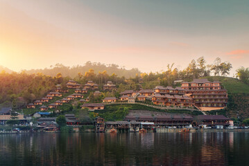 Wall Mural - Ban Rak Thai Village is a Chinese settlement with lake during sunset in Mae Hong Son province near Chiangmai, Thailand.