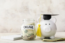 Piggy Bank With Graduation Hat And Jar With Money For Education On Table. Tuition Fees Concept