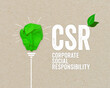 Green paper light bulb metaphor for recycling and acronym CSR - corporate social responsibility renewable energy green climate concept on brown recycled paper