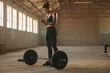 © Jacob Lund - Fit woman about to start barbell workout