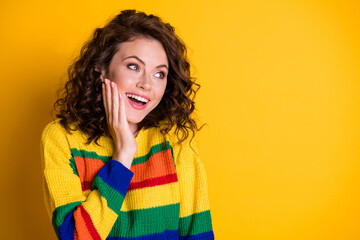 Wall Mural - Close-up portrait of nice lovely cheerful cheery girl looking aside copy empty space isolated on bright yellow color background