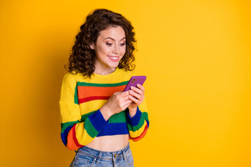 Sticker - Photo of cute optimistic brunette hair young lady chatting telephone wear pullover isolated on bright yellow background