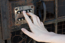 Female Hand Dials The Code On A Vintage Old Combination Door Lock