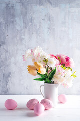 Wall Mural - Easter greeting card backdrop with colorful spring flowers on white background. With copy space