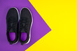 Top view of  black sport shoes sneakers on purple violet yellow  background. Losing weight and sport concept. Flat Lay.Copy space. 