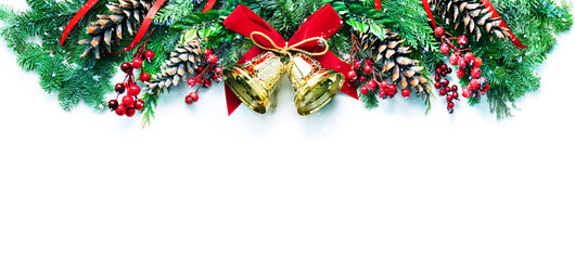 Wall Mural - decoration from snowy pine branches, cones, holly and christmas bells