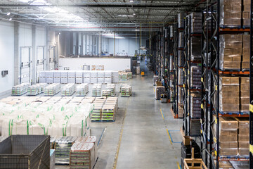 Huge distribution warehouse with high shelves, view from above