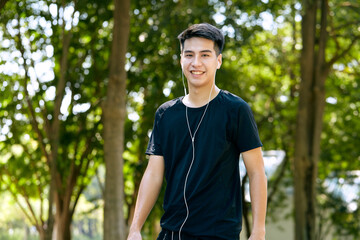 Wall Mural - Young Man Jogging in the park