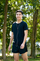 Wall Mural - Young Man Jogging in the park