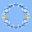 Jewish holiday Hanukkah greeting card traditional Chanukah symbols- dreidels spinning top, donuts, menorah candles, oil jar, star David illustration in wreath