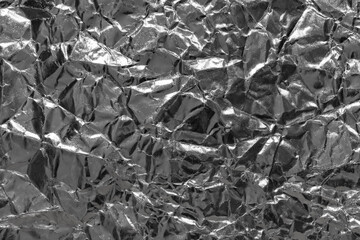  Crumpled aluminum metal foil with ambient reflection.