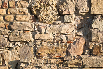 he stone background.wall of old ancient stones and bricks