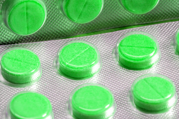 Poster - green tablets in blister. medical drugs
