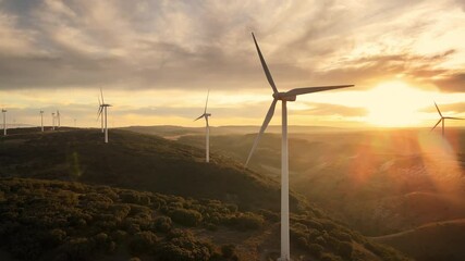 scenic aerial view of wind turbines farm in sunset time. high quality 4k footage