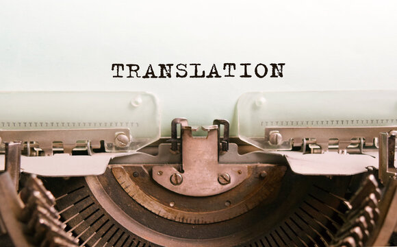 The text TRANSLATION is typed on paper by an antique typewriter. Vintage inscription, retro style, grunge, concept.
