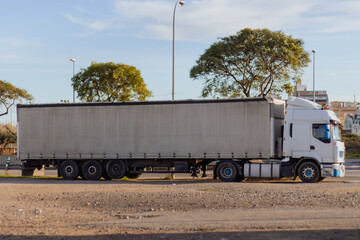 large white articulated truck side view for off-road parking cargo