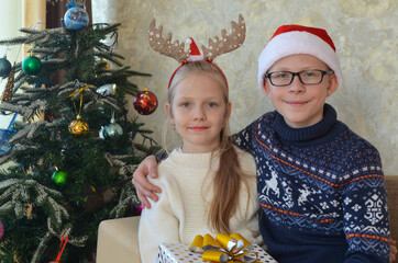 Happy caucasian family celebrating christmas holiday at home. Children having fun together lifestyle